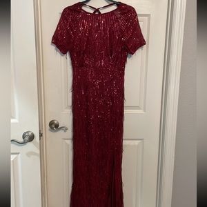 New. Burgundy long dress. Fits as a medium. Great quality material, never worn
